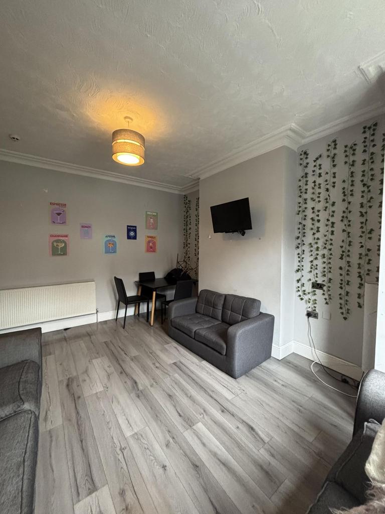 Bright and inviting living room featuring a com...