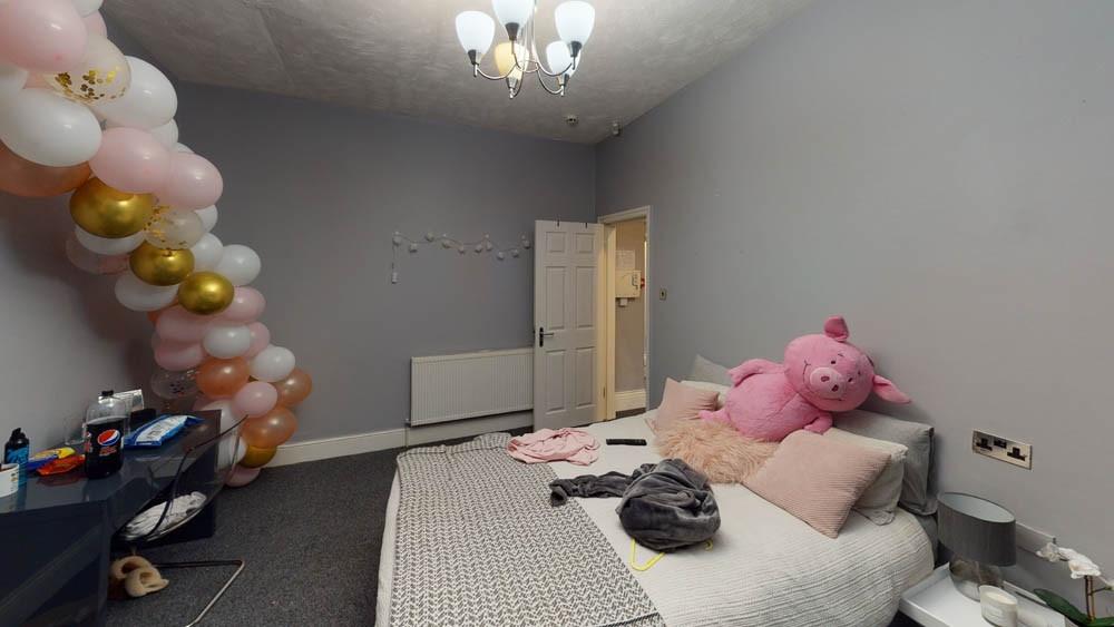 A cozy bedroom featuring a double bed with plus...