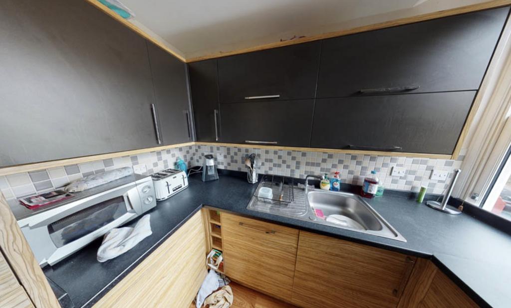 Bright and modern kitchen area with ample count...