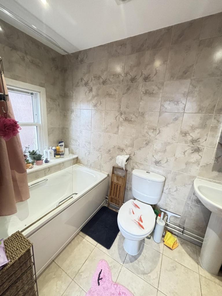 A clean and well-maintained bathroom with a bat...