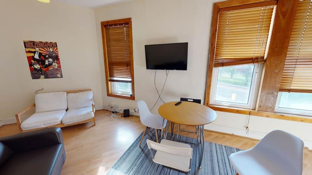 A bright and welcoming living room featuring na...