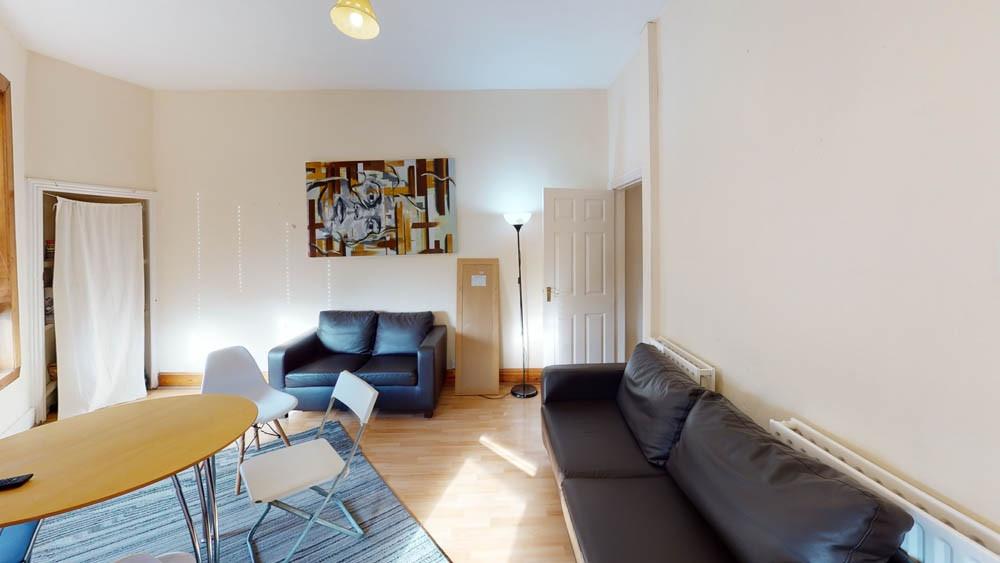 A bright and welcoming living room featuring co...