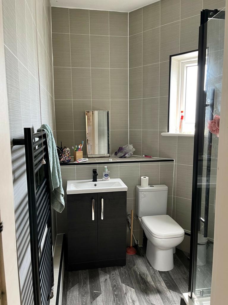 A modern, well-maintained bathroom with a conve...