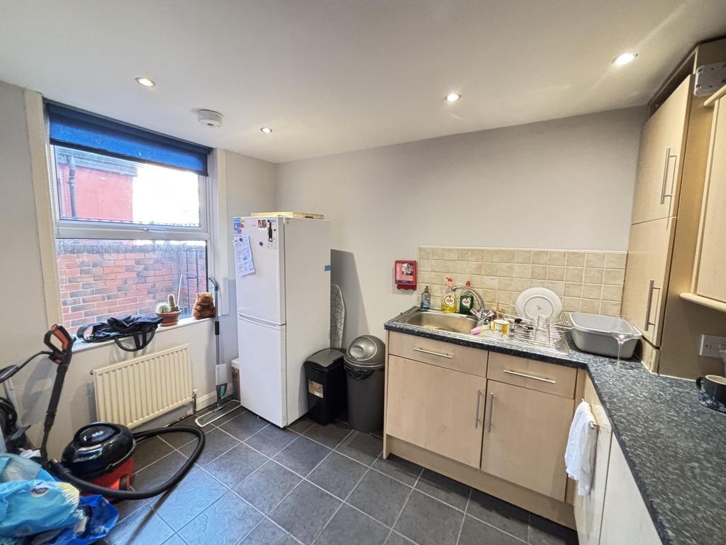 Bright and functional kitchen area with suffici...