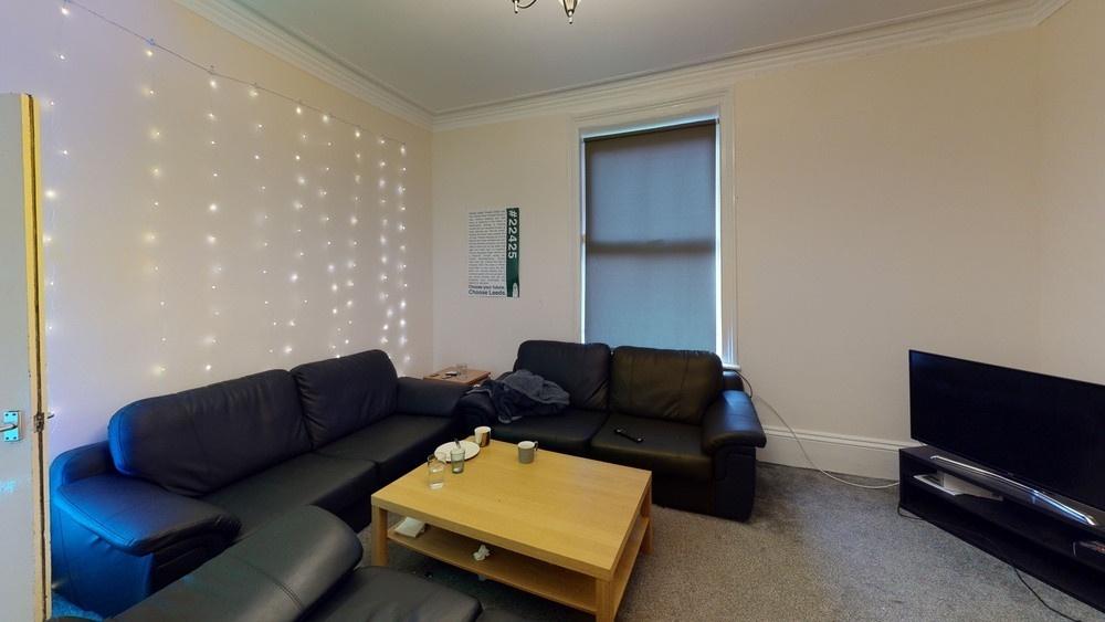 A spacious and modern living room featuring a l...