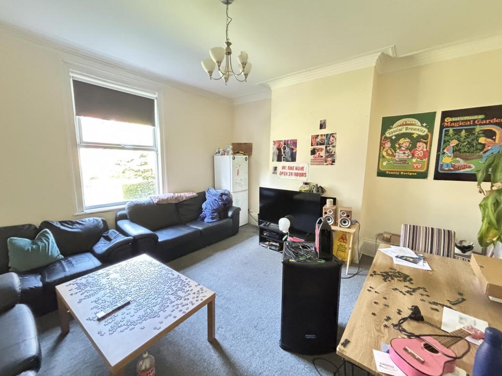 Bright and spacious living room filled with com...