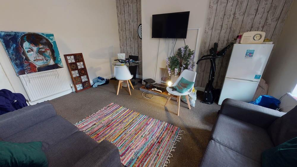 A contemporary living room featuring a large so...
