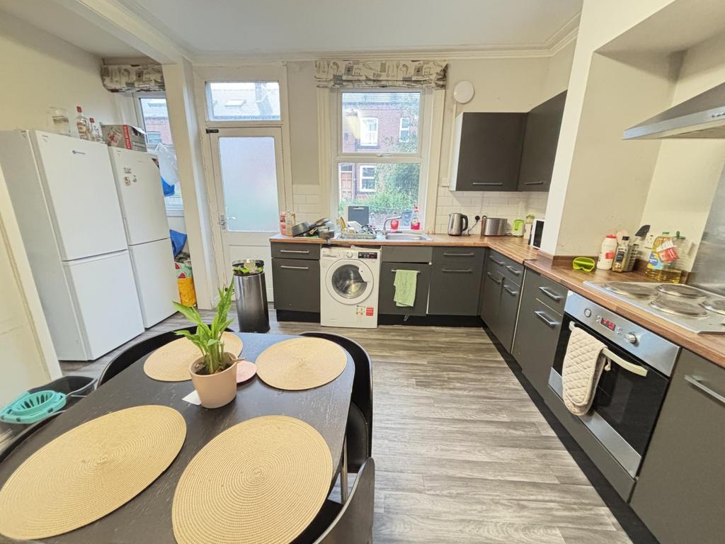 Bright and modern kitchen with ample counter sp...