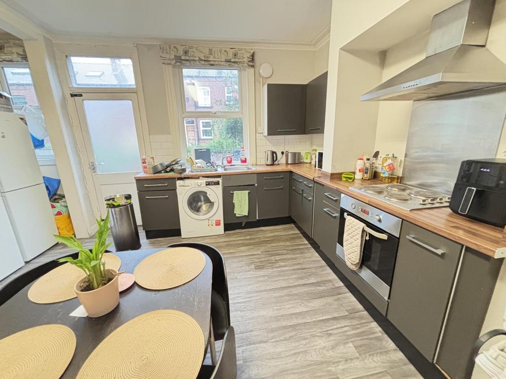 Bright and modern kitchen featuring ample count...