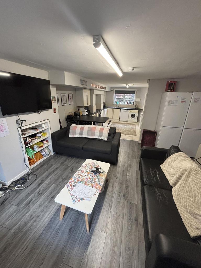 A bright, modern living room featuring comforta...