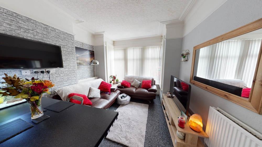 A spacious and modern living room filled with n...