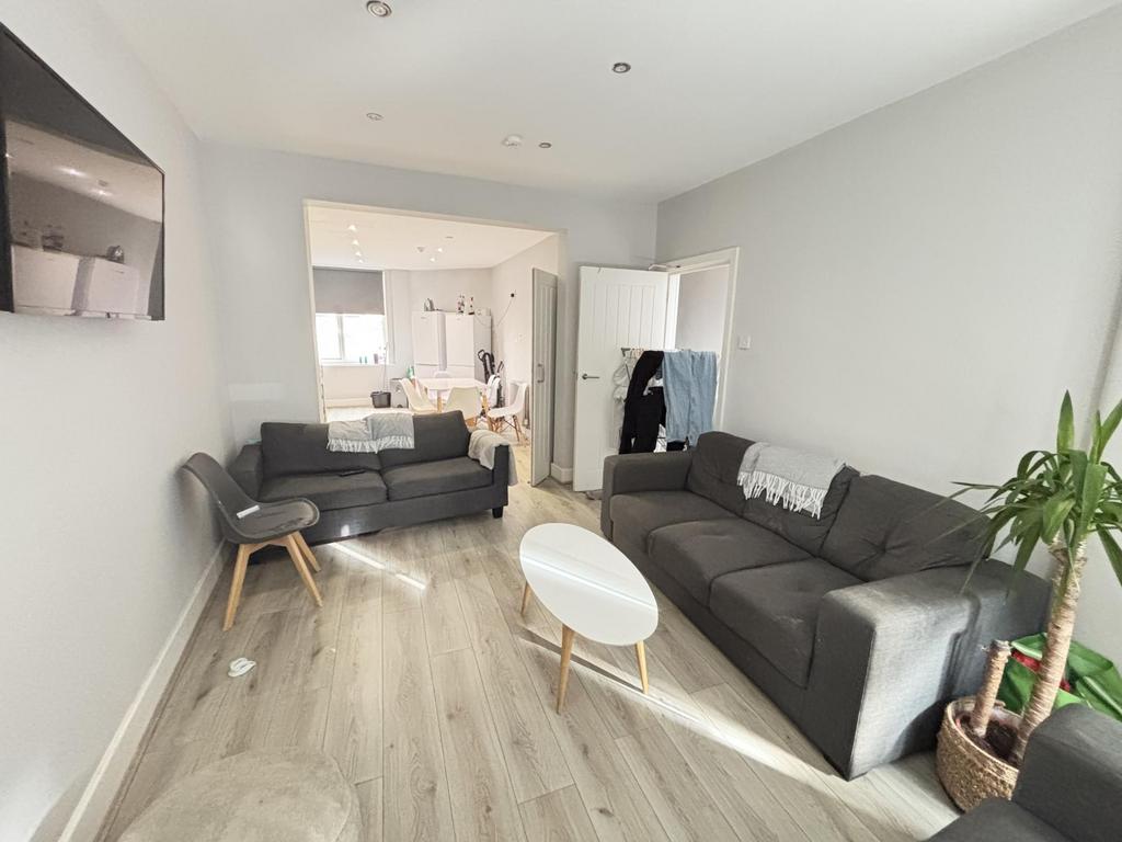 Bright and modern living room with ample natura...