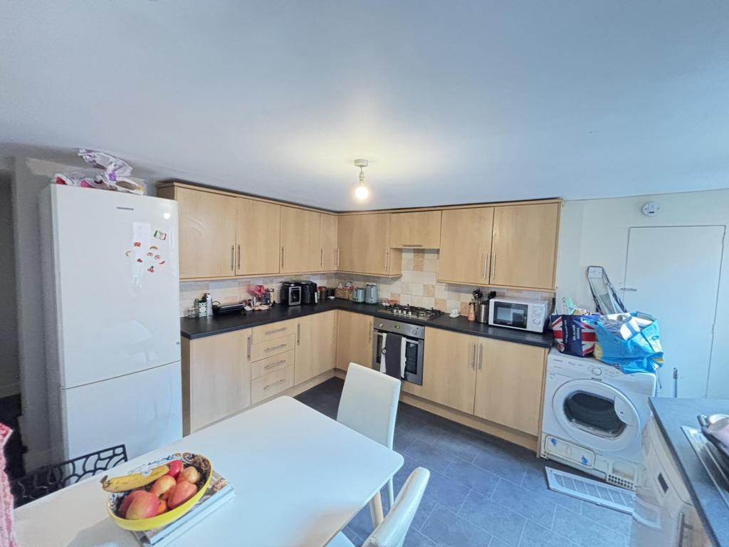 Bright and functional kitchen with ample counte...