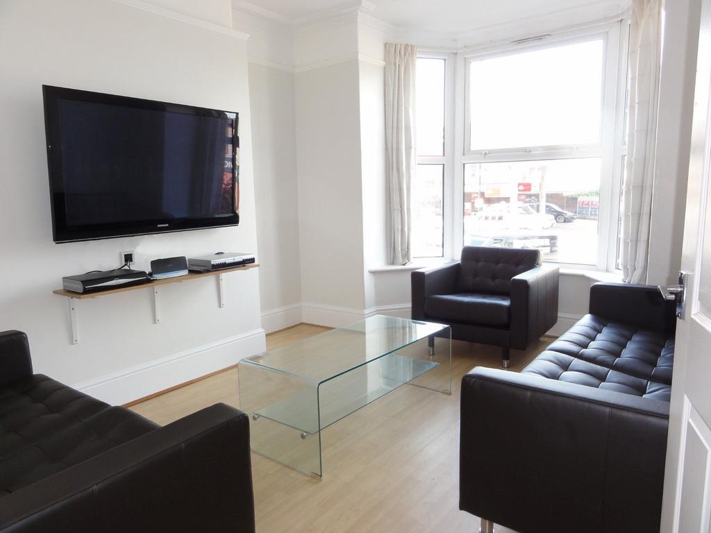 Bright and modern living room featuring three b...