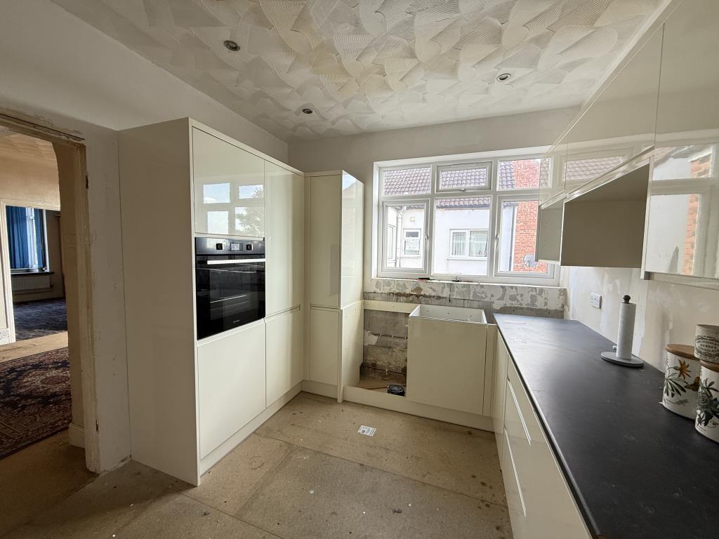 Unfinished kitchen with modern fitted units