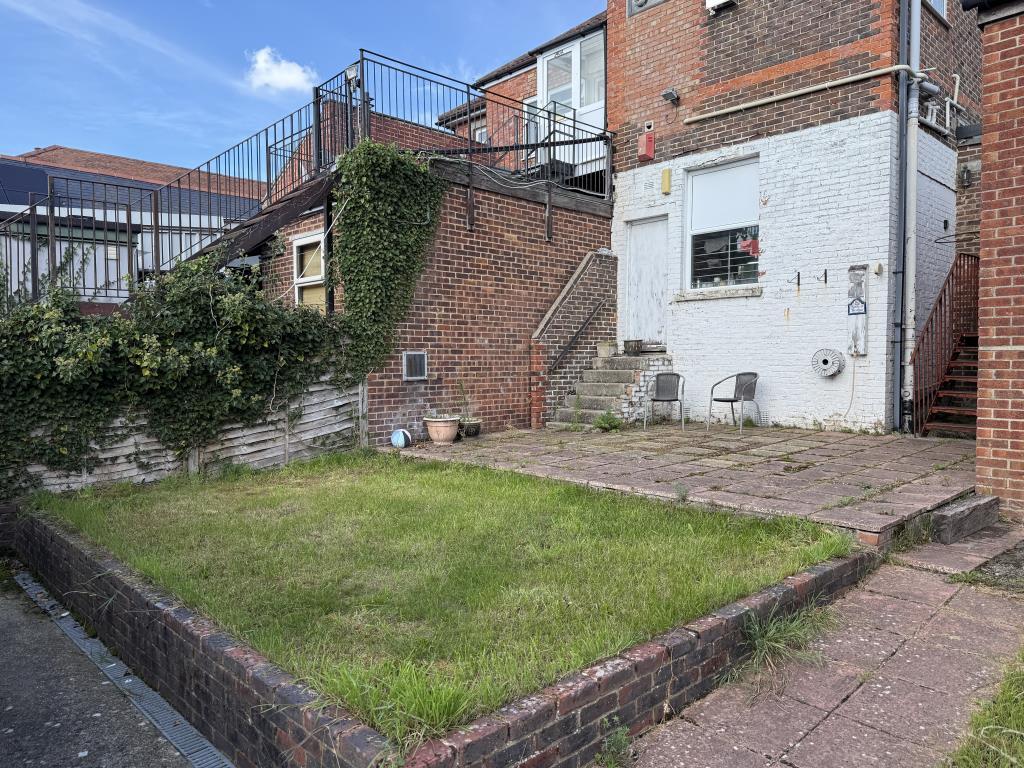 Garden with patio and grass lawn