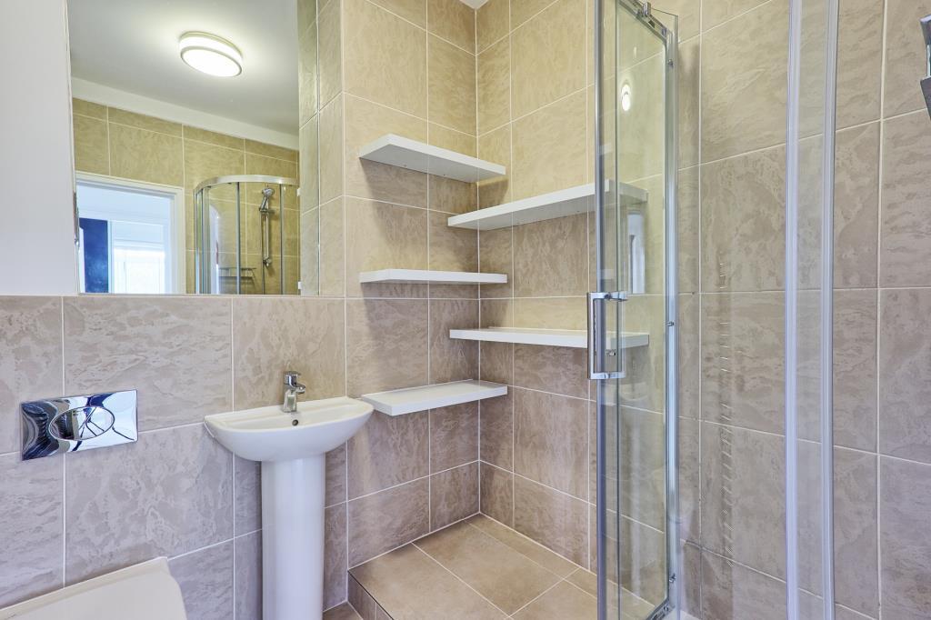 Shower room with toilet, sink and step in shower w