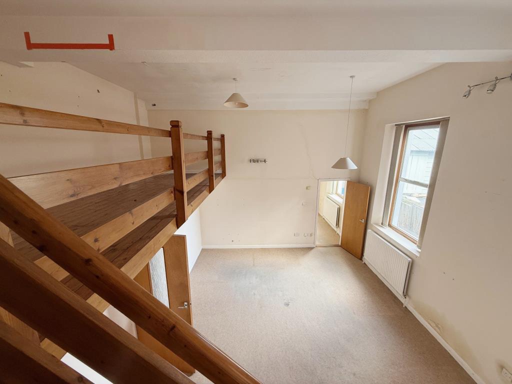 Larger office with raised level looking down to th