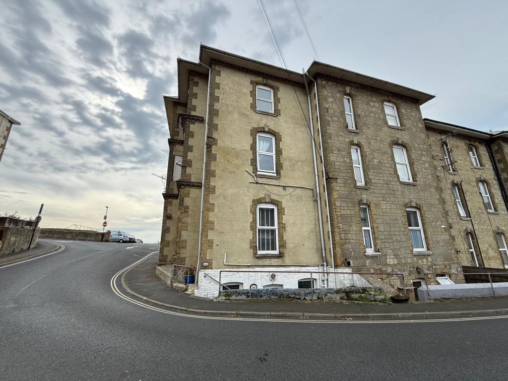 Rear of the building with stairs to access the fla