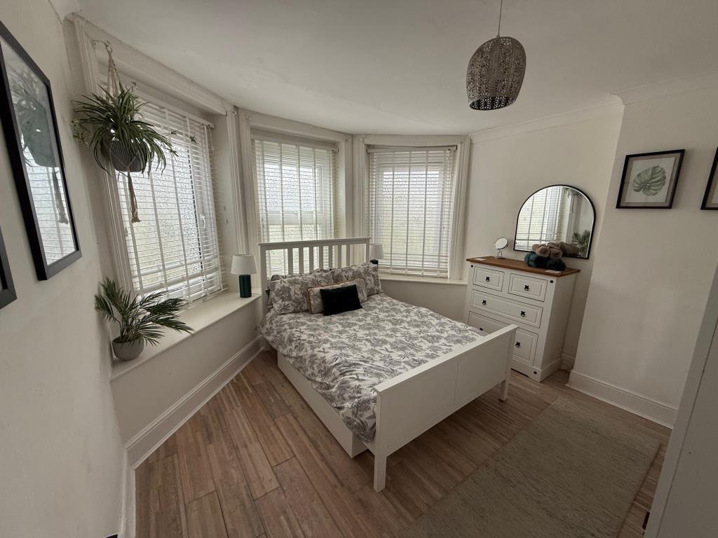 Bedroom with bay window at the front of the buildi