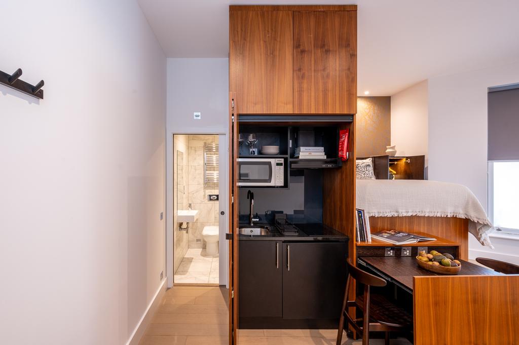 A smart, compact single bedroom featuring a coz...