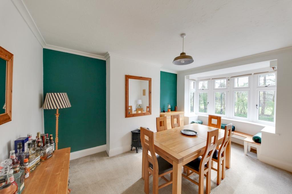 Full dining room with bay window and bespoke windo