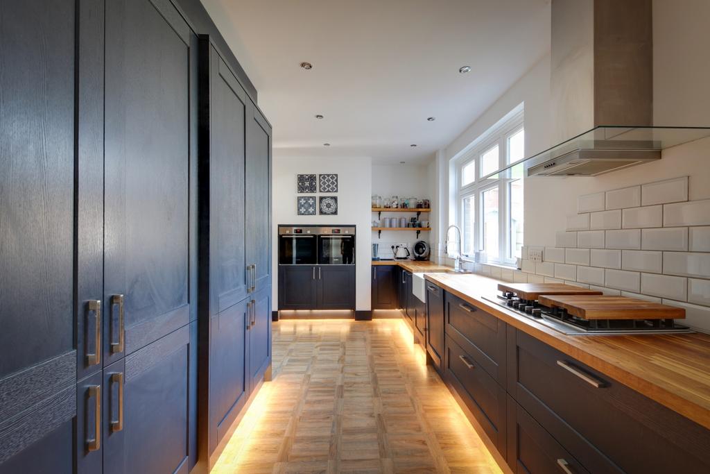 Modern blue shaker kitchen with double oven