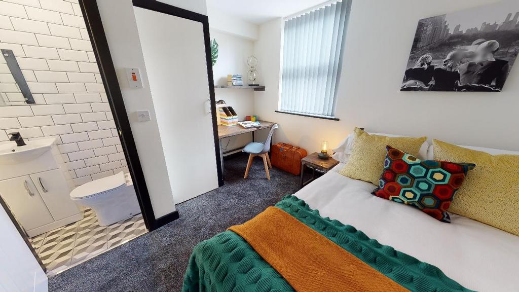 A bright and inviting double bedroom featuring ...