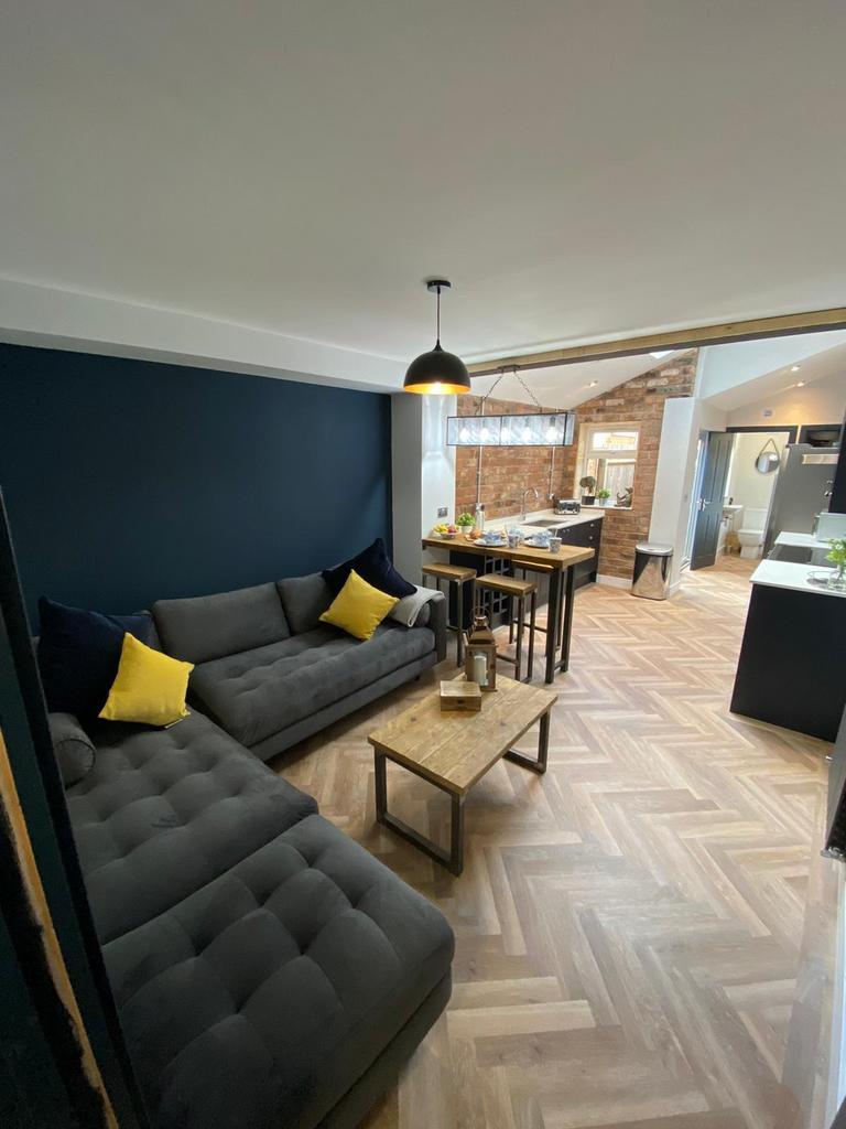 Modern and inviting living room featuring styli...