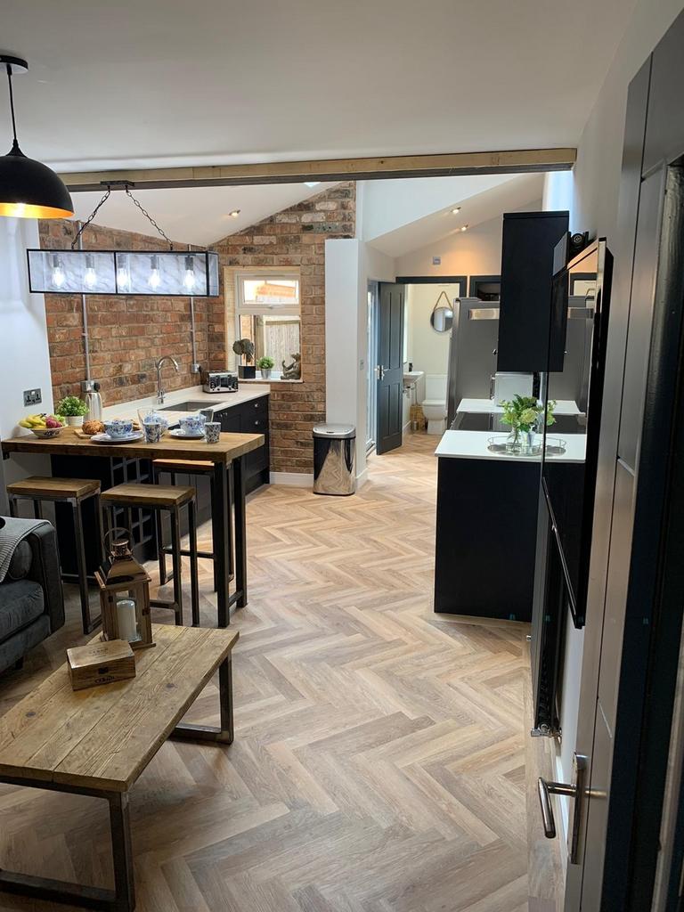 Modern and stylish kitchen featuring sleek blac...