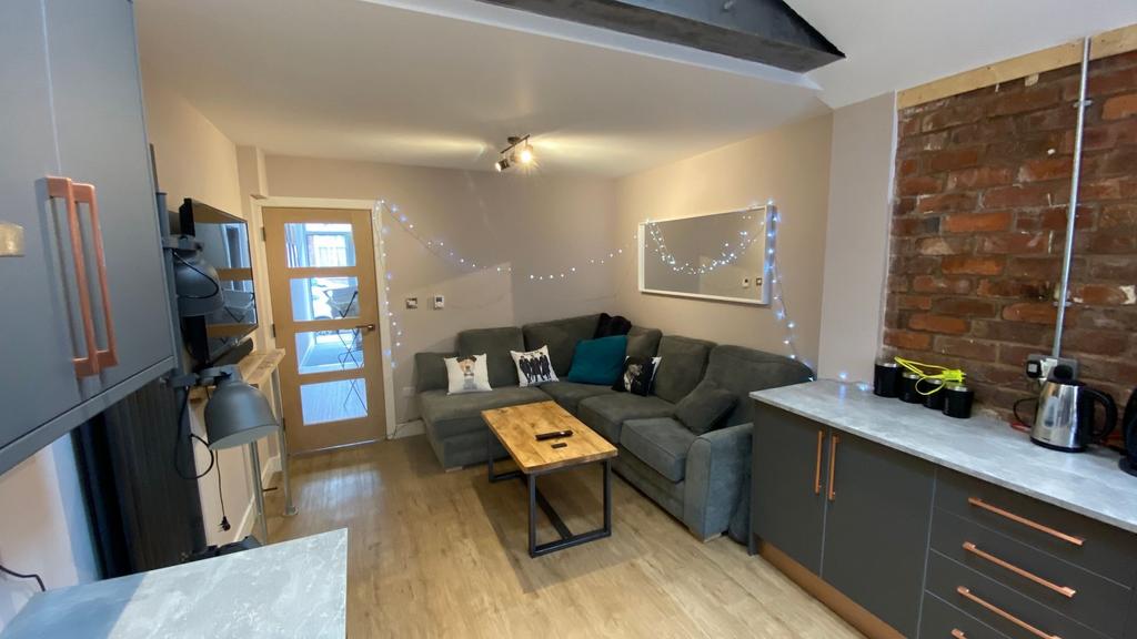 A cozy and welcoming living room featuring a co...