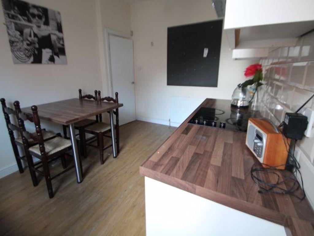 A modern, well-maintained kitchen area with a w...