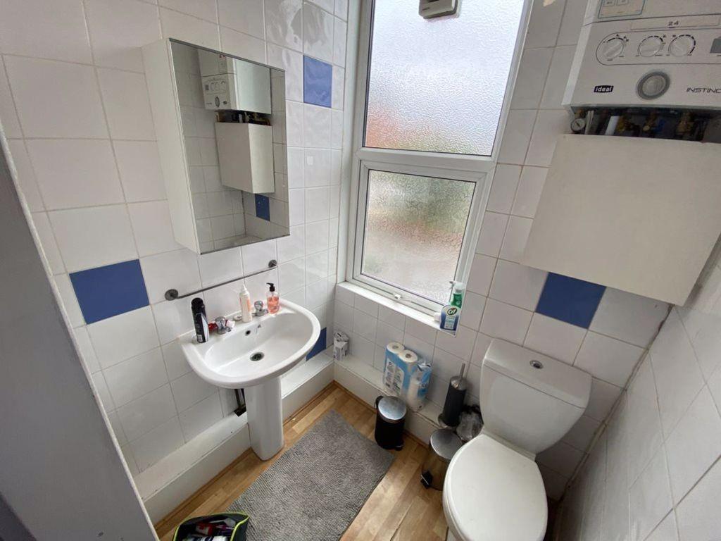 A clean and well-maintained bathroom featuring ...