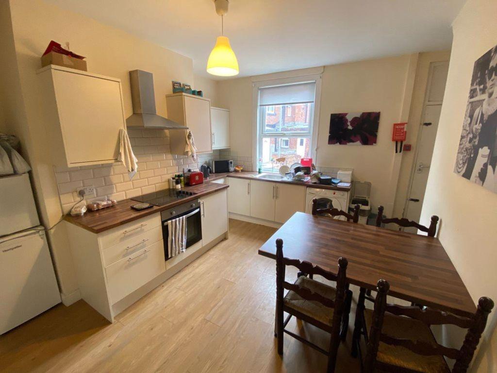 Bright and functional kitchen with ample natura...