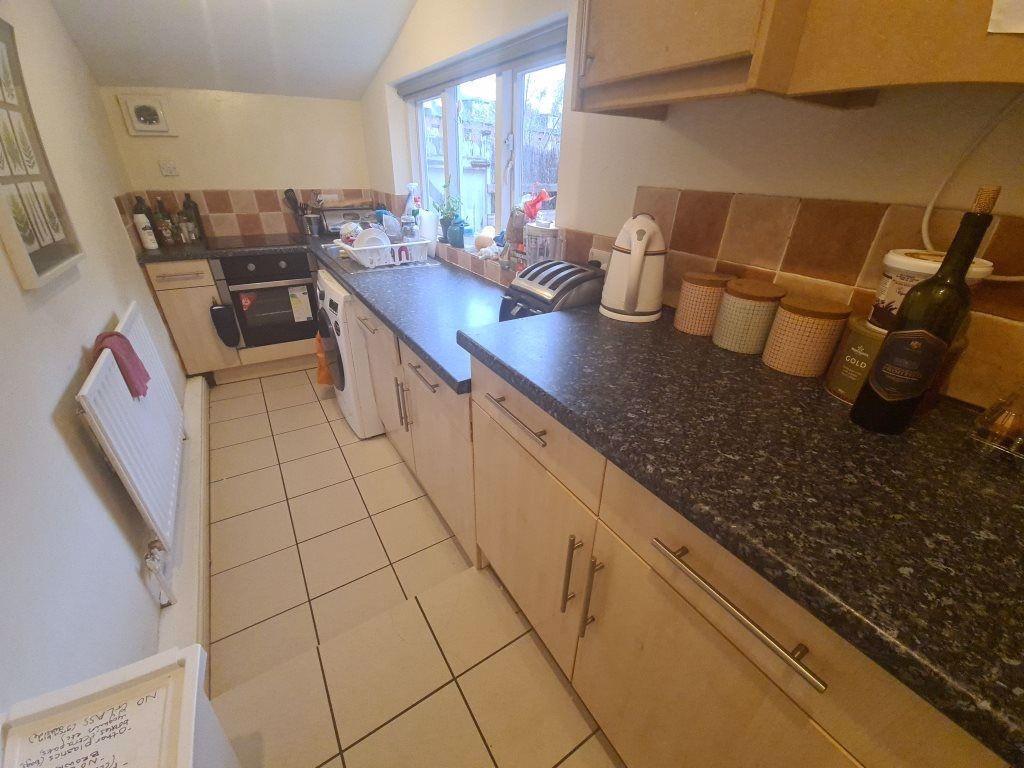 A bright and well-organized kitchen with ample ...