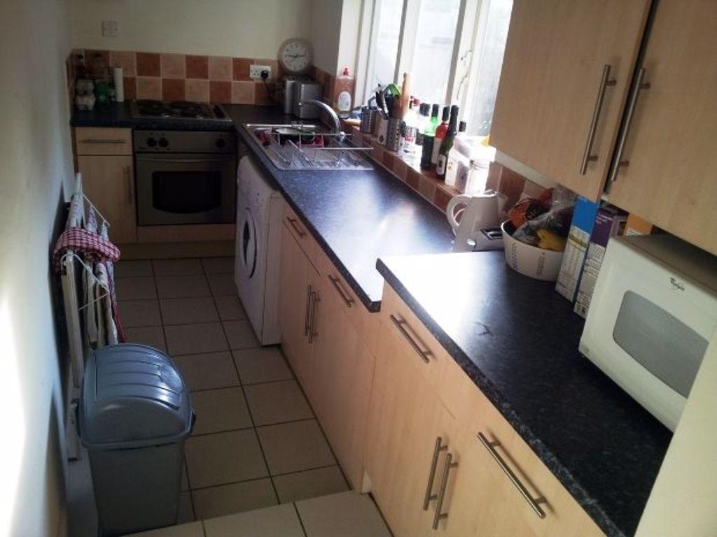 A well-equipped kitchen space featuring a clean...