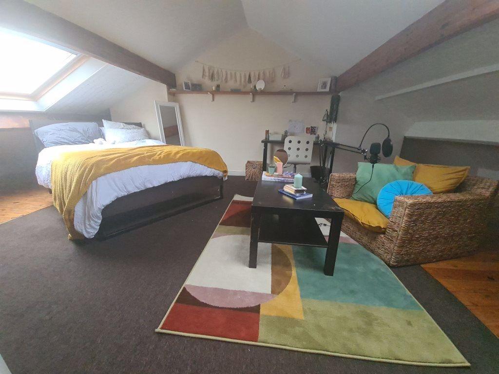 A spacious and well-lit contemporary living roo...