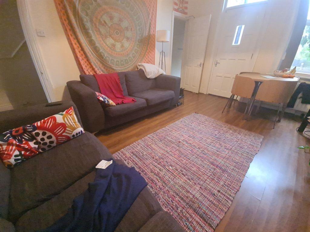 A spacious and inviting living room featuring c...