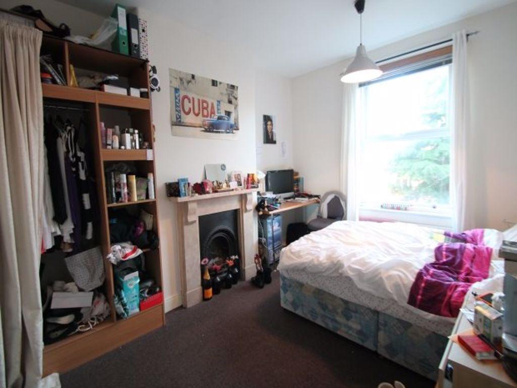 A bright and cozy double bedroom featuring a la...