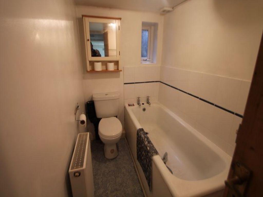 A clean and well-maintained bathroom with a bat...
