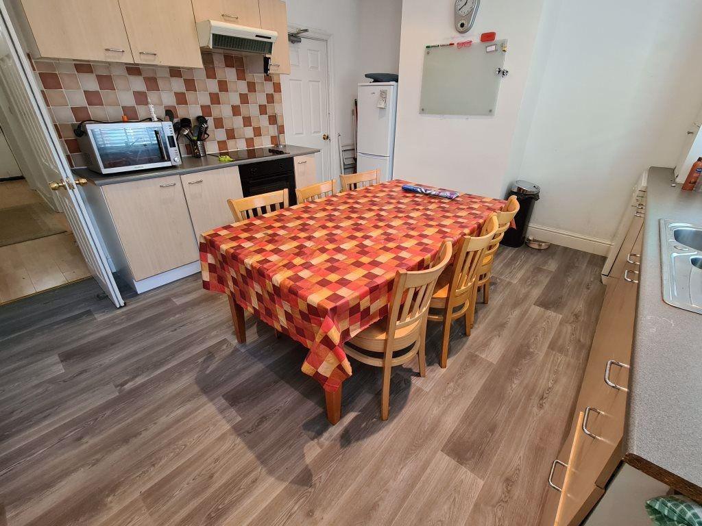 A well-maintained kitchen with a functional lay...