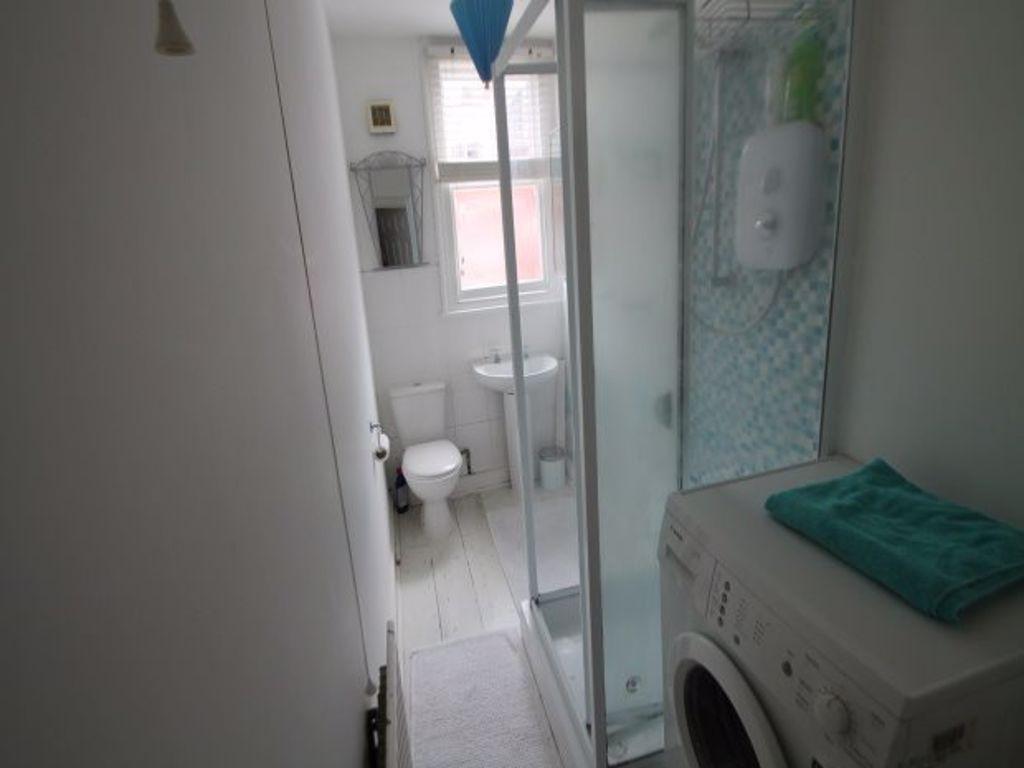 A clean and well-maintained bathroom with a sho...
