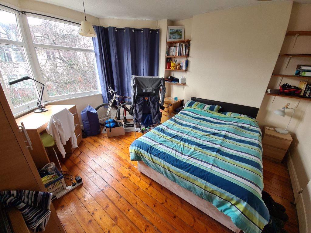 A cozy and inviting bedroom featuring a double ...