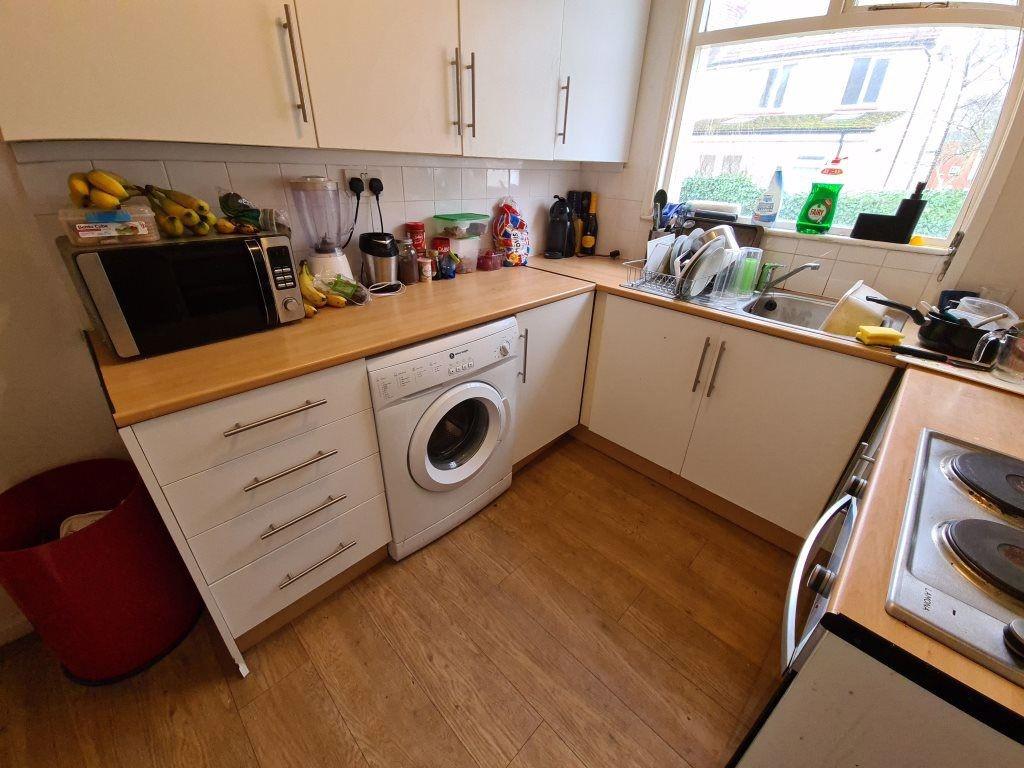 A well-maintained kitchen featuring modern appl...