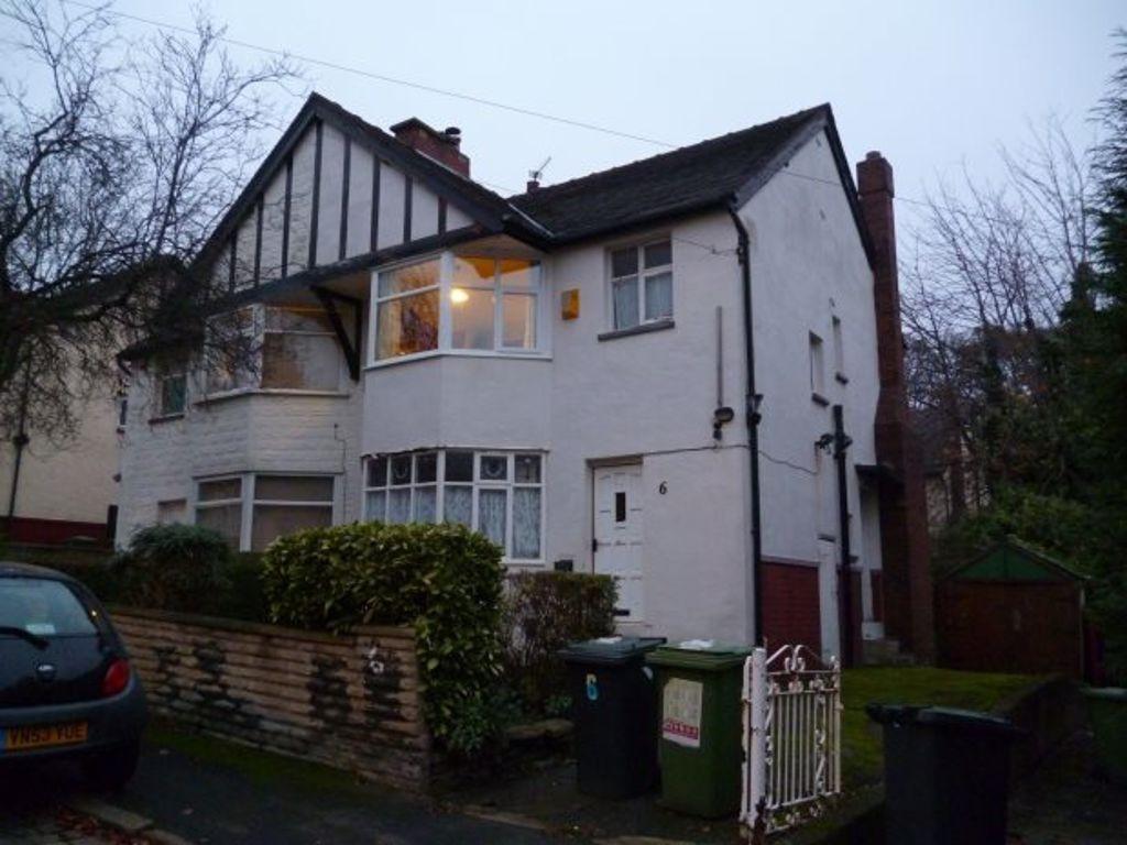 A charming front view of a traditional detached...