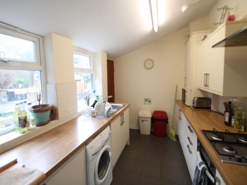 A bright and functional kitchen with ample coun...