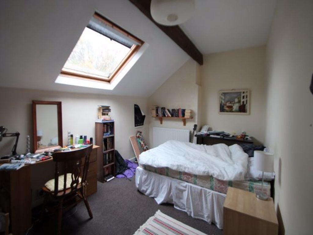 Bright and inviting bedroom with a comfortable ...
