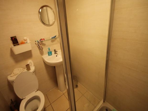 A clean and well-maintained bathroom with a sho...