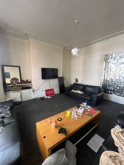 A spacious and inviting living room with ample ...
