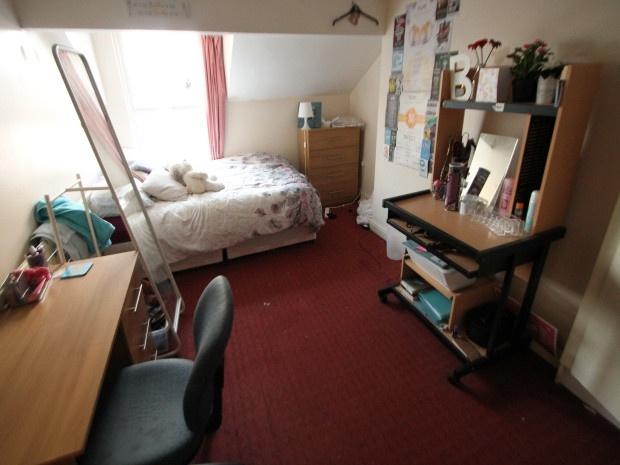 A cozy and well-maintained living room with nat...